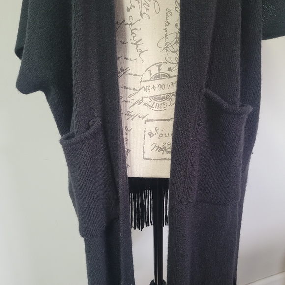 Black, turtleneck poncho with fringe at the bottom in OS. - Picture 5 of 8